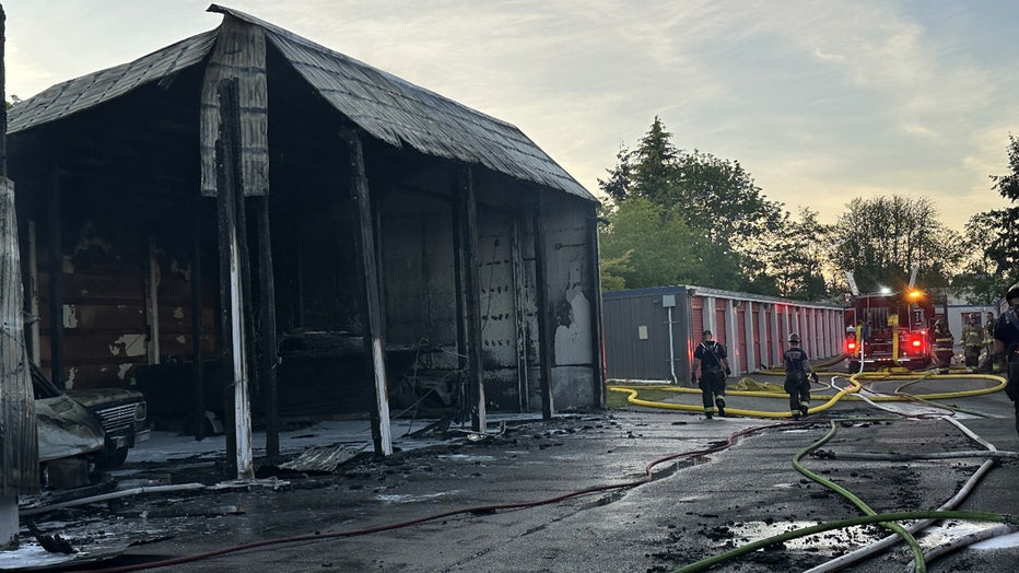 More than 60 firefighters responded to a fire at a storage facility in Everett on Monday evening. According to South County Fire (SCF), crews were dispatched to the building near the corner of 4th Avenue West and 132nd Street Southwest, along I-5, at around 6:30 p.m. When the first crew arrived, they quickly determined additional support was needed, and the response was upgraded to a two-alarm fire. SCF said a column of smoke could be seen for miles. Authorities said the fire destroyed about 13 storage bays used to house vehicles, and more than a dozen other units sustained heat damage. Firefighters were able to save an adjoining shop that contained flammable chemicals. SCF reported no injuries. Crews monitored the site overnight to ensure there were no flare-ups. SCF thanked the Everett Fire Department, Kukilteo Fire Department and Paine Field Airport Fire Department for their assistance. The Snohomish County Fire Marshal's Office is leading the investigation into the cause of the fire. This is a developing story. Check back for updates.