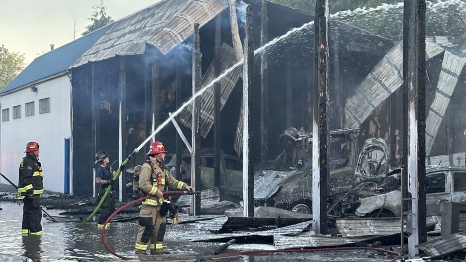 More than 60 firefighters responded to a fire at a storage facility in Everett on Monday evening. According to South County Fire (SCF), crews were dispatched to the building near the corner of 4th Avenue West and 132nd Street Southwest, along I-5, at around 6:30 p.m. When the first crew arrived, they quickly determined additional support was needed, and the response was upgraded to a two-alarm fire. SCF said a column of smoke could be seen for miles. Authorities said the fire destroyed about 13 storage bays used to house vehicles, and more than a dozen other units sustained heat damage. Firefighters were able to save an adjoining shop that contained flammable chemicals. SCF reported no injuries. Crews monitored the site overnight to ensure there were no flare-ups. SCF thanked the Everett Fire Department, Kukilteo Fire Department and Paine Field Airport Fire Department for their assistance. The Snohomish County Fire Marshal's Office is leading the investigation into the cause of the fire. This is a developing story. Check back for updates.
