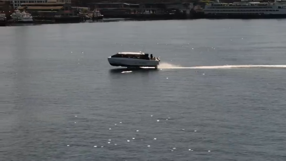 all-electric ferry prototype moving across the top of the water