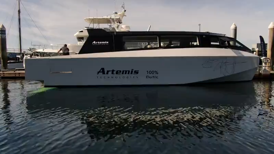 all-electric water taxi tied up to dock