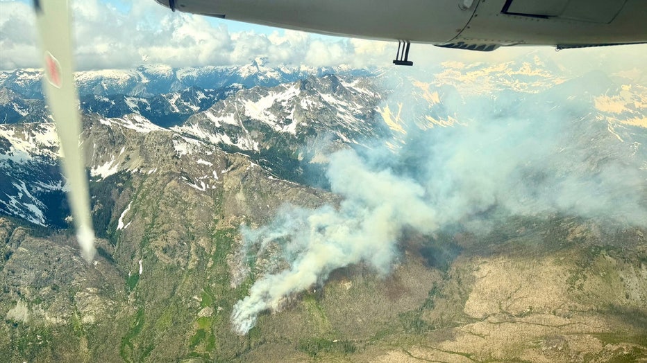 Crews are working to contain a wildfire burning northwest of Entiat, Washington. In a Thursday update, crews say the Pomas Fire has burned more than 900 acres and is 0% contained. The Pomas Fire was first reported at 10:40 a.m. on Friday, June 13. At the time, it was only 15 acres in size. On Monday, additional firefighters, including two hotshot crews and rappelers, arrived to assist ground resources to suppress the fire. Officials say scoopers will continue to dip out of Lake Chelan, while helicopters will use Fern and Myrtle Lakes for water bucket work.