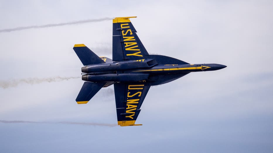 us navy blue angel flying in sky