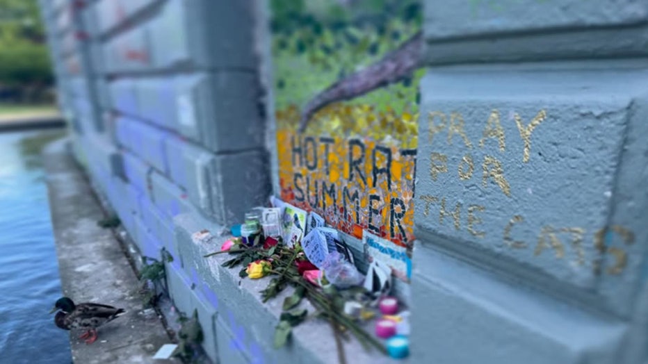 Flowers candles and messages left for Saint Rat at the Hot Rat Summer mosaic mural in Seattle's Cal Anderson Park
