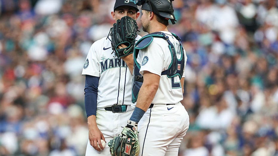 Seattle Mariners game tonight. George Kirby talking to Cal Raleigh at the mound.