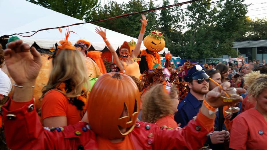 people dancing at pumpkin festival