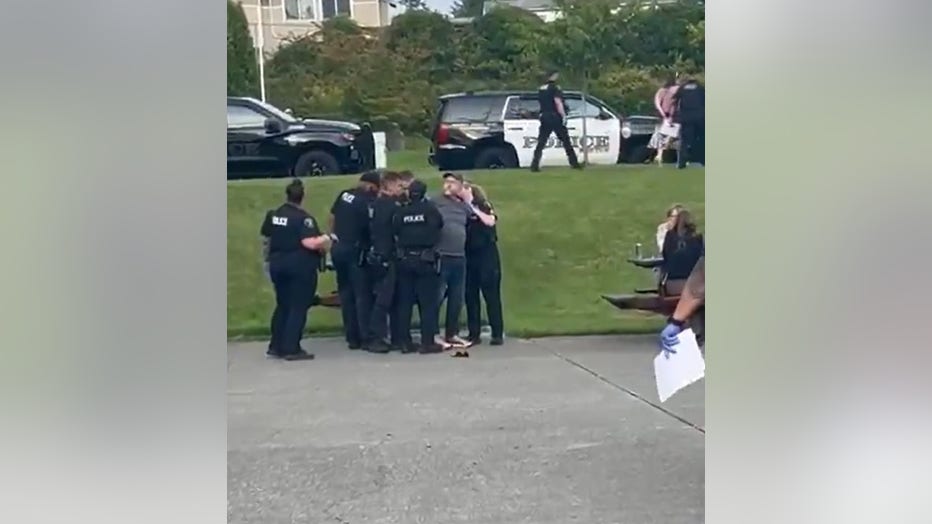 Protesters arrested at Adam Smith town hall