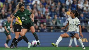 Seattle Reign match suspended after Racing Louisville midfielder Savannah DeMelo collapses
