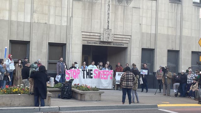 People gather outside Tacoma, WA City Hall to protest expansion of camping ban