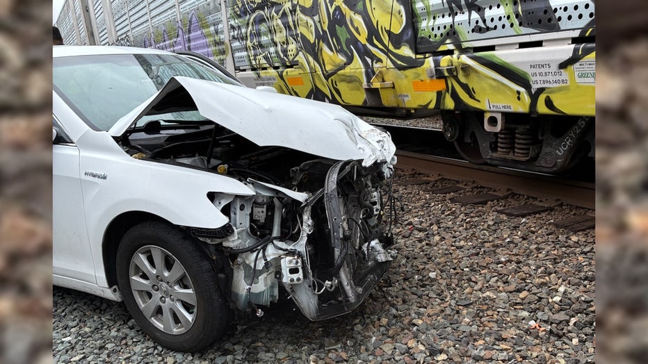 A car was hit by a train in Edmonds on Tuesday, causing traffic backups and ferry delays. The crash happened on Main Street, where minor injuries were reported and streets remained fully blocked. The Edmonds-Kingston ferry route was temporarily suspended but expected to resume once the train cleared the terminal.