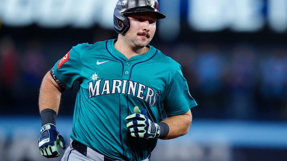 cal raleigh running the bases after hitting a home run