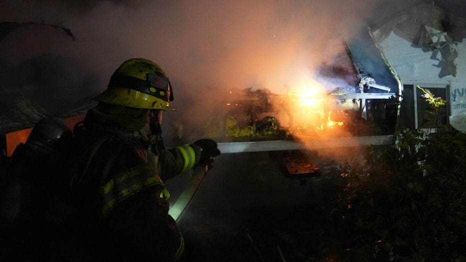 Firefighters rescued eight dogs, including six husky puppies, after an overnight fire displaced a family in Monroe early Tuesday morning. According to Snohomish Regional Fire and Rescue (SRFR), crews responded to a structure fire near 208th Place Southeast and Old Monroe Duvall Highway at around 2 a.m. Firefighters had to navigate a steep dirt road to find the home and discovered a 5th-wheel trailer and a nearby home were fully engulfed in flames. The residents had safely evacuated before firefighters arrived. Since the area lacked nearby fire hydrants, Snohomish County Fire District 4 and Duvall Fire were called in to assist in maintaining the water supply. SRFR said a primary search confirmed everyone made it out safely, but they also rescued six husky puppies and two adult huskies. 