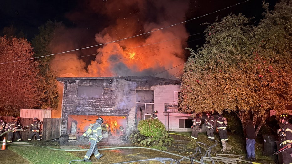Crews are investigating after a house caught fire in Kent's East Hill neighborhood Thursday morning. Puget Sound Fire made the initial announcement on social media at around 5:26 a.m., saying firefighters were responding to a fully engulfed house fire near 108th Place Southeast and Southeast 235th Street. FOX 13 crews arrived at the scene to gather more information. Firefighters said they could see flames from the fire about three to four blocks away. With assistance from the Renton Fire Department, it took crews about 45 minutes to knock down most of the flames. Crews were also able to prevent the fire from spreading and causing major damage to two nearby homes. According to Puget Sound Fire, everyone inside – three people and three dogs – managed to escape safely. They have been connected with the American Red Cross. Residents in neighboring houses also evacuated safely. One neighbor told FOX 13 they heard explosions coming from the home at around 4:30 a.m., which woke up the neighborhood. The exact cause of the fire remains under investigation.