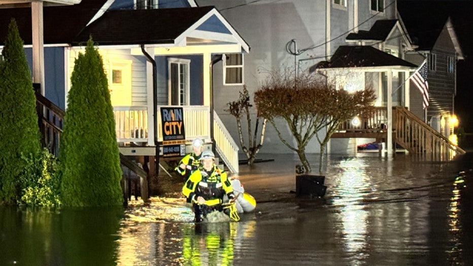 this morning, Snohomish County Fire District #4 deployed four rescue swimmers to assist evacuating residents from their homes. Their homes began taking in flood waters late Wednesday evening. The rescue swimmers used an inflatable kayak to successfully evacuate five adults, one child, three dogs, and three cats to safety. Other affected residents on Lincoln Ave have chosen to shelter in place. There are multiple road closures in the district with signs in place; however, many do not. SCFD #4 urges the community not to drive through floodwater. Please turn around and have alternative routes available, and if at all possible, please stay home. Please see the four attached photos of this morning's evacuation.