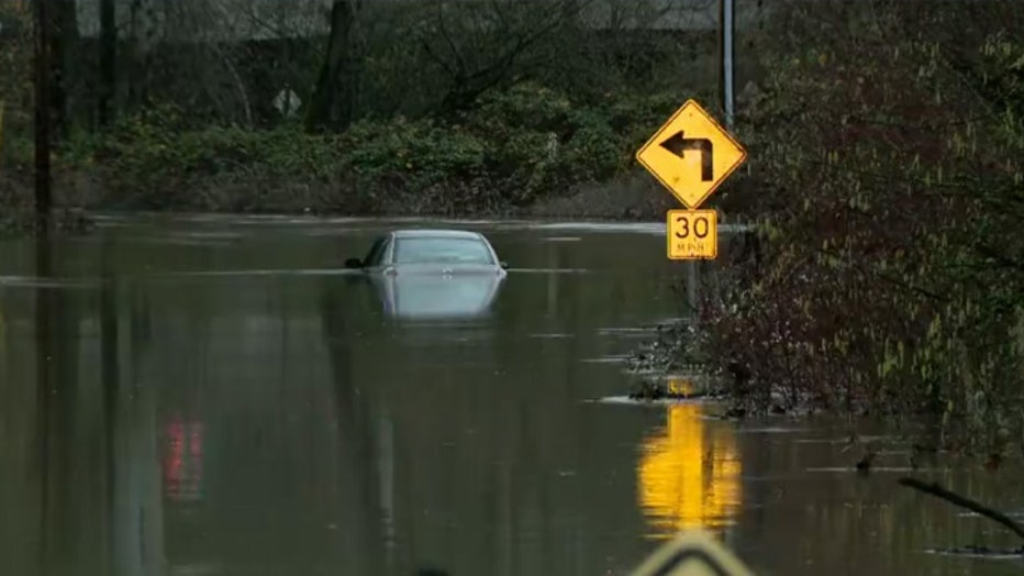 FOX 13 Seattle crews are in Sumner, where multiple vehicles appear to be almost completely submerged in floodwaters.