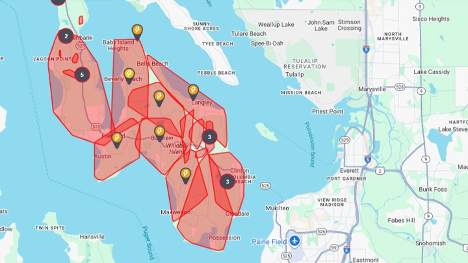 A photo taken from Mukilteo shows Whidbey Island without power in the distance.