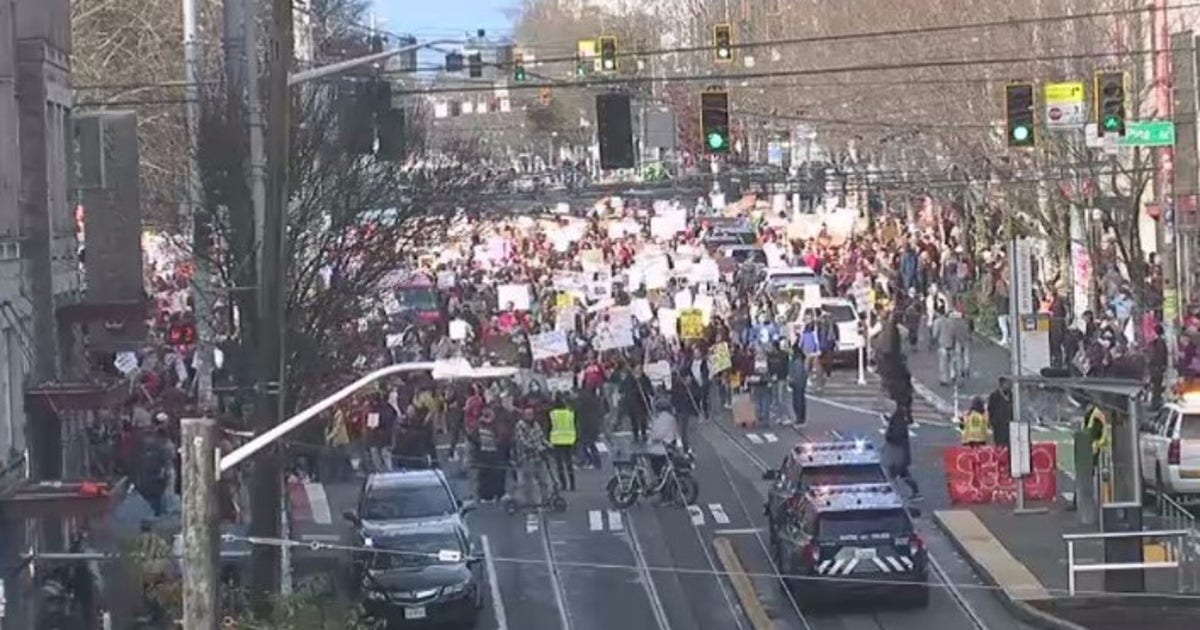 'ICE Out Now' demonstrators move through Seattle on Saturday