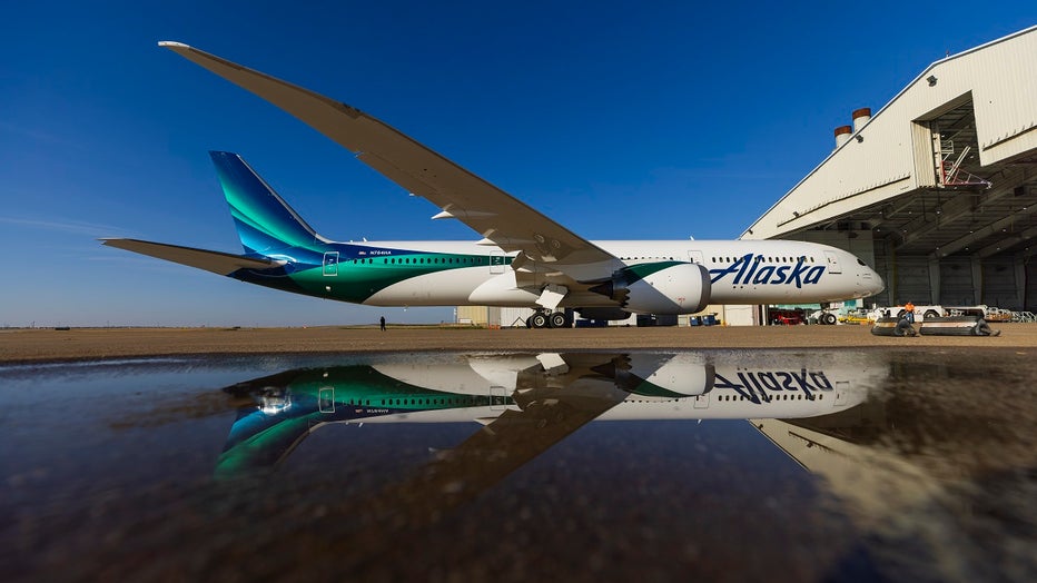 alaska airlines plane with new global livery photo