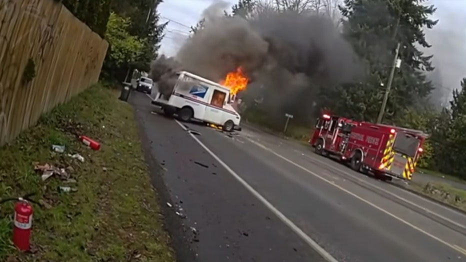 The Pierce County Sheriff’s Office (PCSO) released new bodycam video of deputies responding to a mail truck that caught fire after a crash earlier this month. On Jan. 10, just after noon, deputies responded to reports of a mail truck on fire after colliding with a sedan near the corner of Park Avenue South and 106th Street South in Tacoma. The first deputy to arrive at the scene saw the U.S. Postal Service truck driver injured and in danger due to the fire. The deputy immediately pulled him away from the burning truck before attempting to extinguish the flames with the help of a female bystander. Authorities said both the mail truck driver and the back-seat passenger of the sedan were injured and transported to nearby hospitals in serious condition. The PCSO thanked Central Pierce Fire and the female bystander for their assistance. Further information about what led up to the crash is limited at this time.