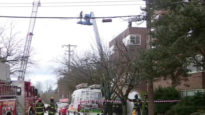 Man trapped in lift after crash sparks fire in Seattle's Queen Anne neighborhood
