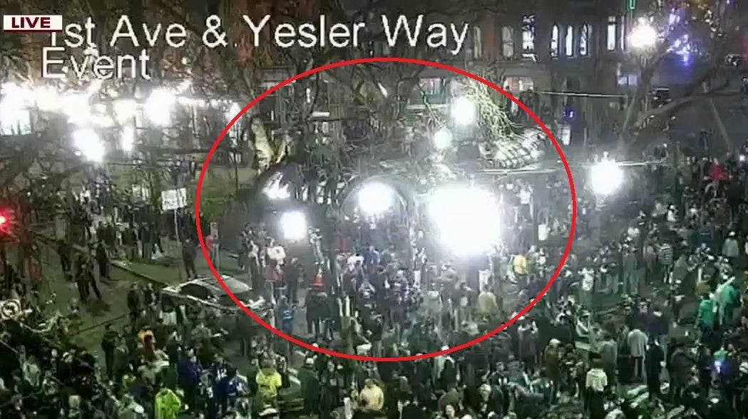 Fans seen climbing Pergola in Seattle's Pioneer Square after Seahawks' Super Bowl win