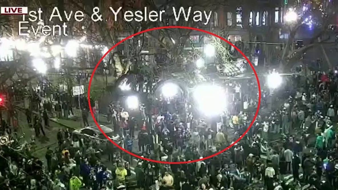 Fans seen climbing Pergola in Seattle's Pioneer Square after Seahawks' Super Bowl win