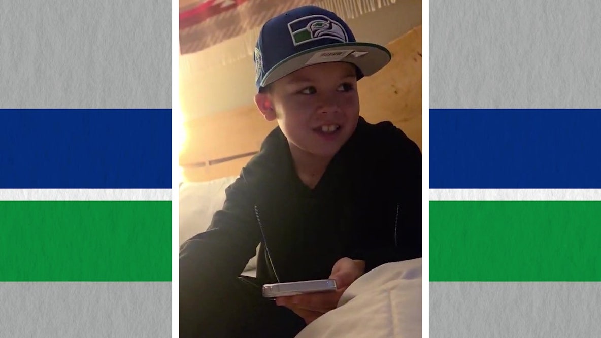 Young 12's lost football at Seattle parade leads to call from Seahawk, community response