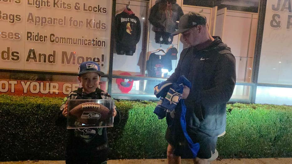 Army First Sergeant steven cracraft gifts little antonio seahawks gear including his signed football