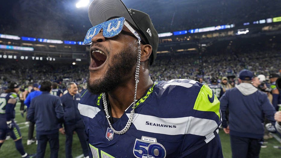 ernest jones on football field with sunglasses