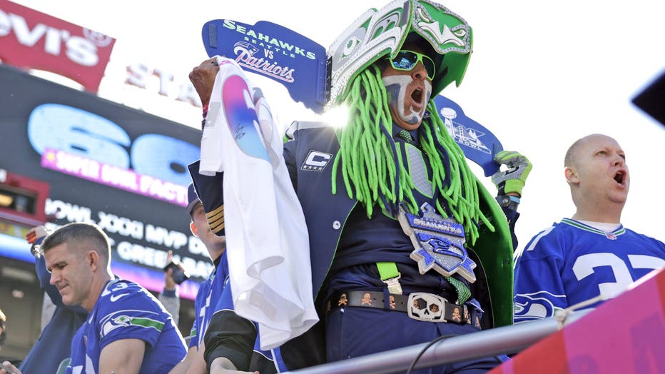 seahawks fan dressed in green and blue hair