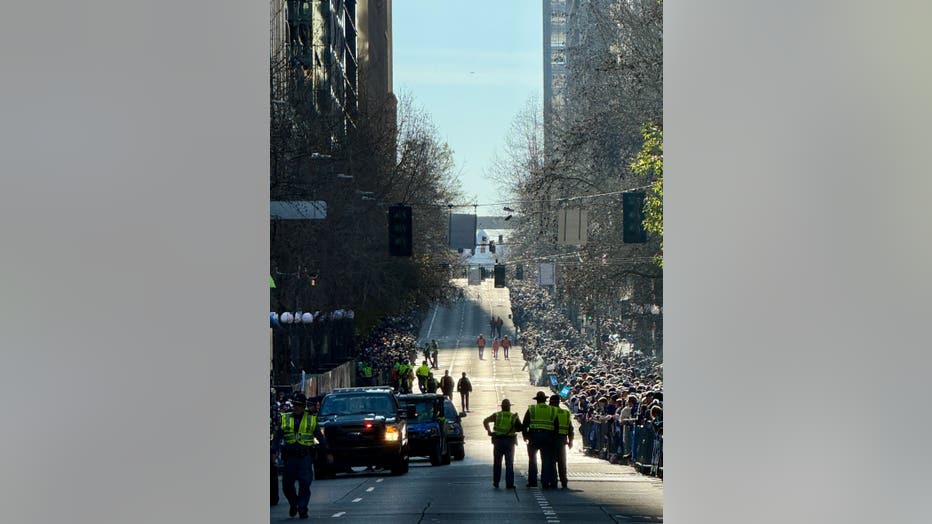 thousands of people line 4th avenue along parade route