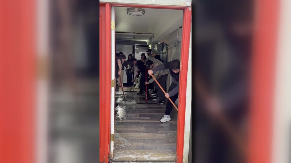 hashem’s family, friends and team members work to repair flood damage at their auburn shop following devastating regional flooding during a december atmospheric river event