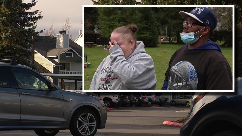 parents of slain 18-year-old jack bartlett in the foreground, the crime scene area at the apartment complex where he was shot in the background