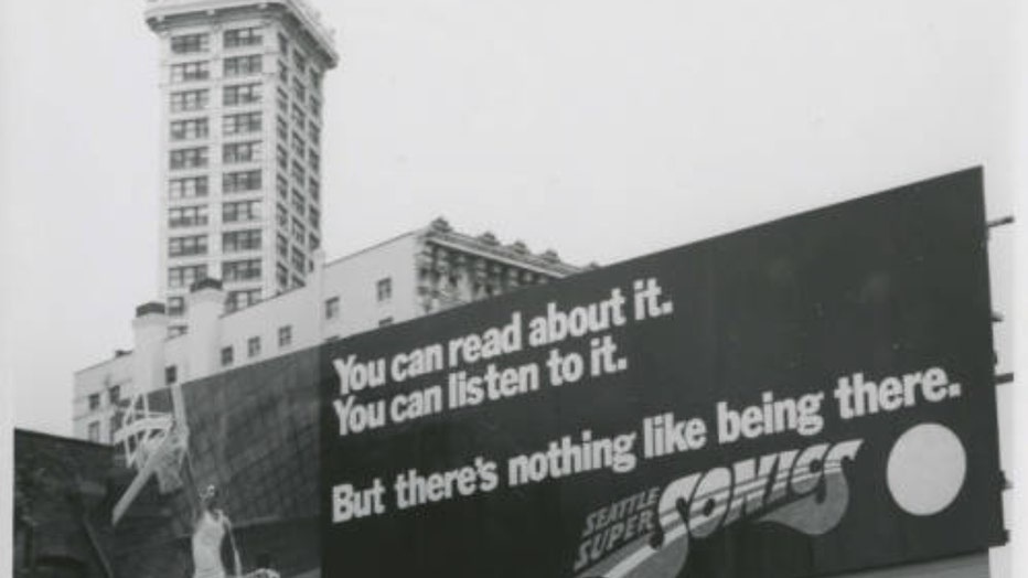 Advertisement for the seattle supersonics in front of the smith tower seattle public library archives