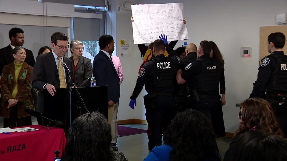 Protester At Bob Ferguson Bill Signing Event