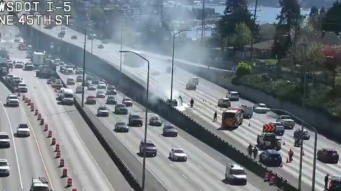 Lanes of southbound I-5 in Seattle blocked by burning car
