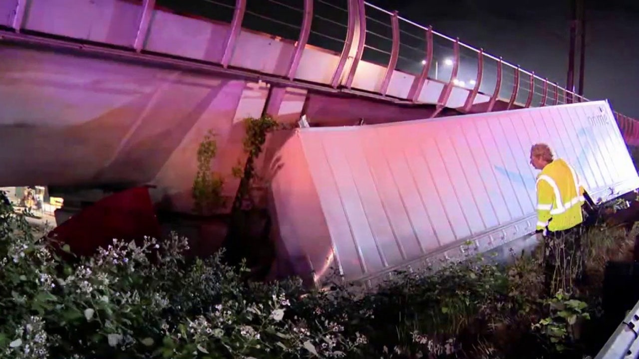 Semi-truck crashes into light rail track in Tukwila, WA