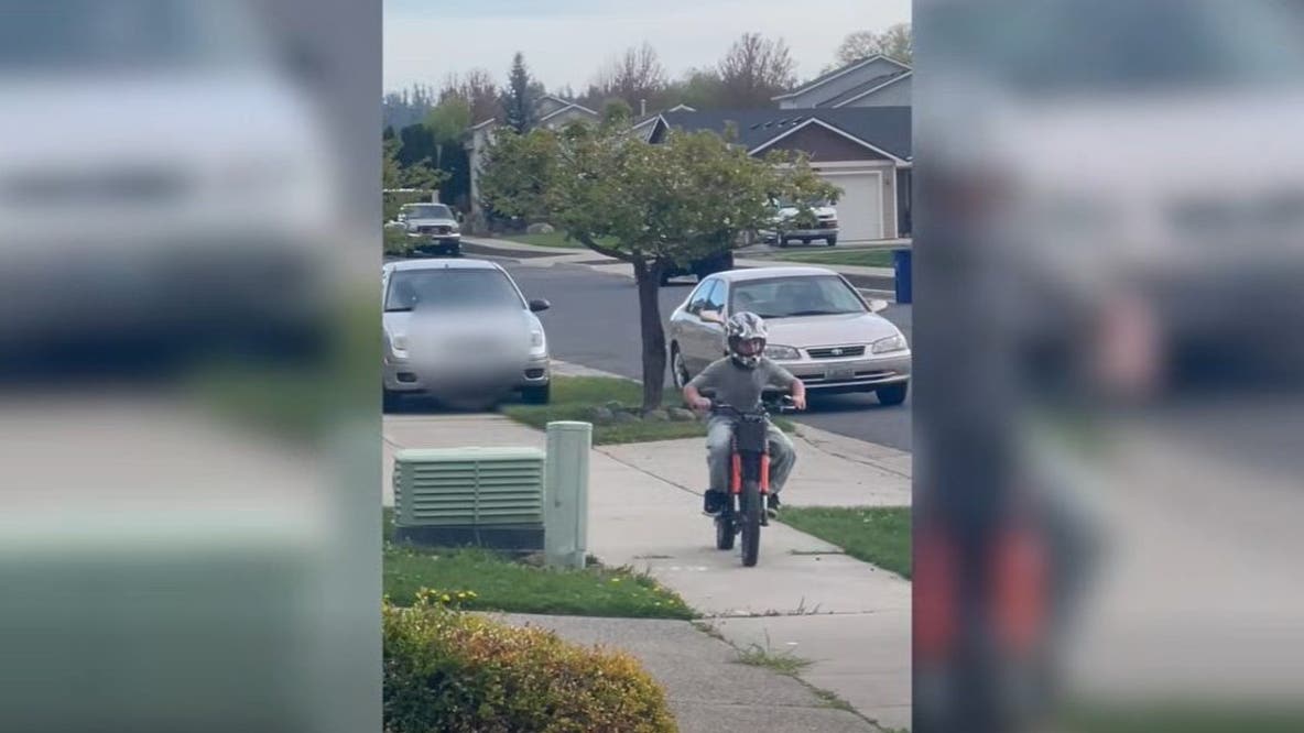 Spokane, WA woman chases child on sidewalk with car: video