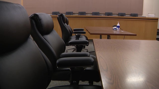 Critics say WA is neglecting to fund public defenders amid caseload cut