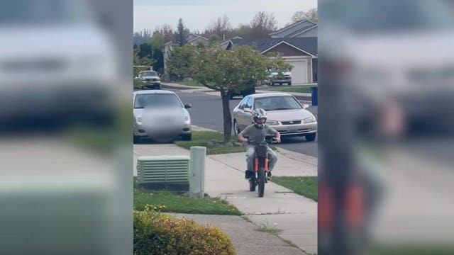 Spokane, WA woman chases child on sidewalk with car: video