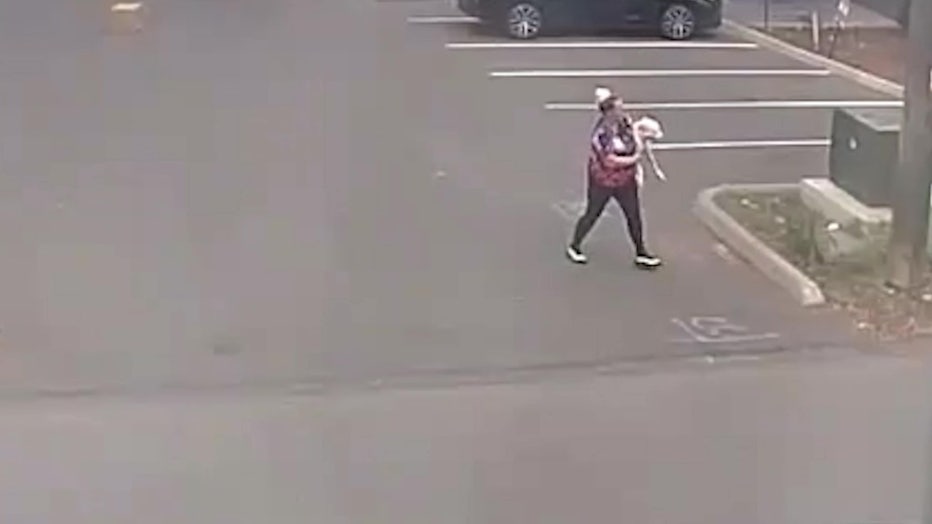 Neighbor carries dog away after the attack
