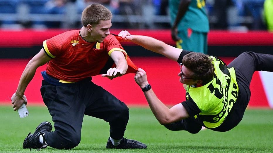 A pitch invader pictured during a soccer game between Belgian national team Red Devils and Senegal, on Wednesday 01 July 2026, at the Seattle Field, in Seattle, a 1/16 finals game in the FIFA World Cup 2026.