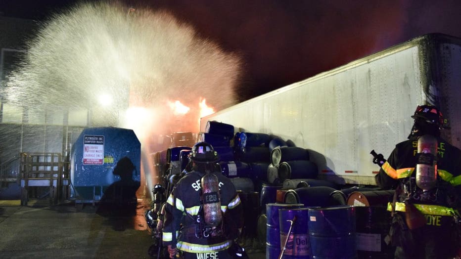 A three-alarm commercial warehouse fire broke out in Seattle's Industrial District early Wednesday morning, drawing more than 100 emergency personnel to the scene. Crews fought the flames defensively due to unidentified barrels found near the building, prompting officials to issue a shelter-in-place advisory for nearby residents. No injuries were reported, and investigators are working to determine what sparked the blaze after the warehouse roof collapsed.