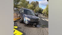 Man arrested after crashing into crosswalk in Redmond