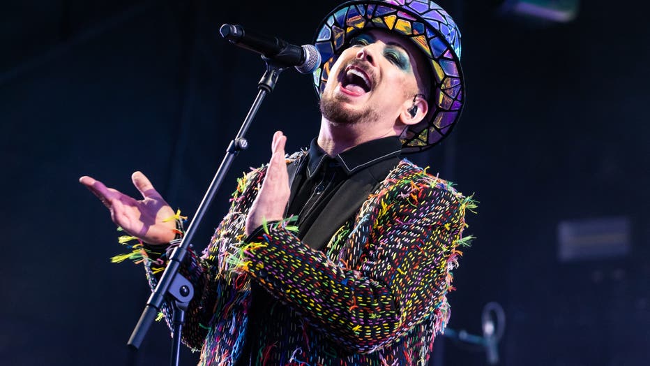boy george singing on stage