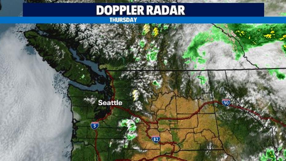 Storms continued to pop up Thursday in the Olympic Mountains and Cascades with bringing with them lightning strikes and gusty winds with the potential to spread or spark additional wildfires. 