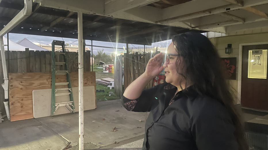 Jackie Murray looks over the yard where the haunted house once stood. 