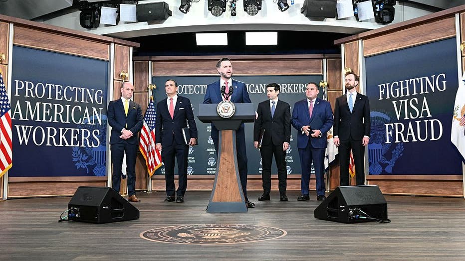 US Vice President JD Vance speaks alongside (L-R) White House Deputy Chief of Staff and Homeland Security Advisor Stephen Miller, US Attorney General Todd Blanche, US Labor Secretary Keith Sonderling, Inspector General of the US Department of Labor Anthony D'Esposito and Federal Trade Commission (FTC) Chair Andrew Ferguson during a press conference to provide an update in the federal investigation and crackdown regarding fraud and abuse of the H-1B visa program in Washington, DC, on October 8, 2026.