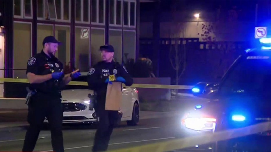 Police are investigating an early Tuesday morning shooting at a North Seattle gas station parking lot. An innocent delivery truck driver sustained minor cuts from glass fragments, but no other injuries were reported. Investigators believe a gold Chevrolet SUV found abandoned nearby was the target of the gunfire, and no suspects are currently in custody.