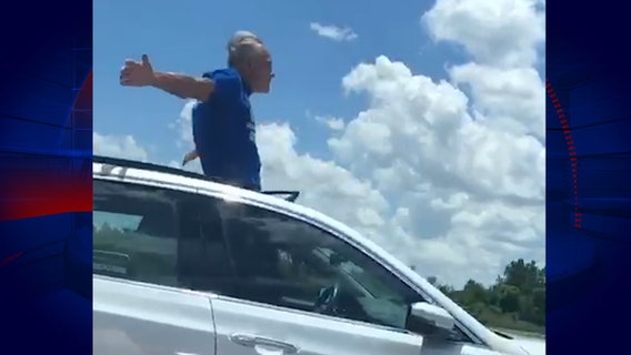 Florida man stands through sunroof while driving down I-4