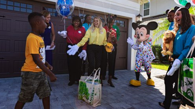 Boy surprised with dream Disney trip after using his vacation money to feed hurricane evacuees